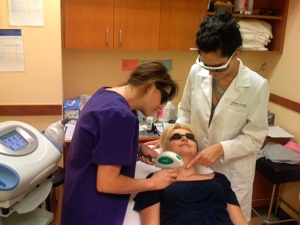A National Laser Institute instructor and student walk through a Botox procedure with a female patient.