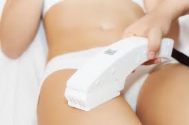An esthetician performing laser hair removal at the National Laser Institute.