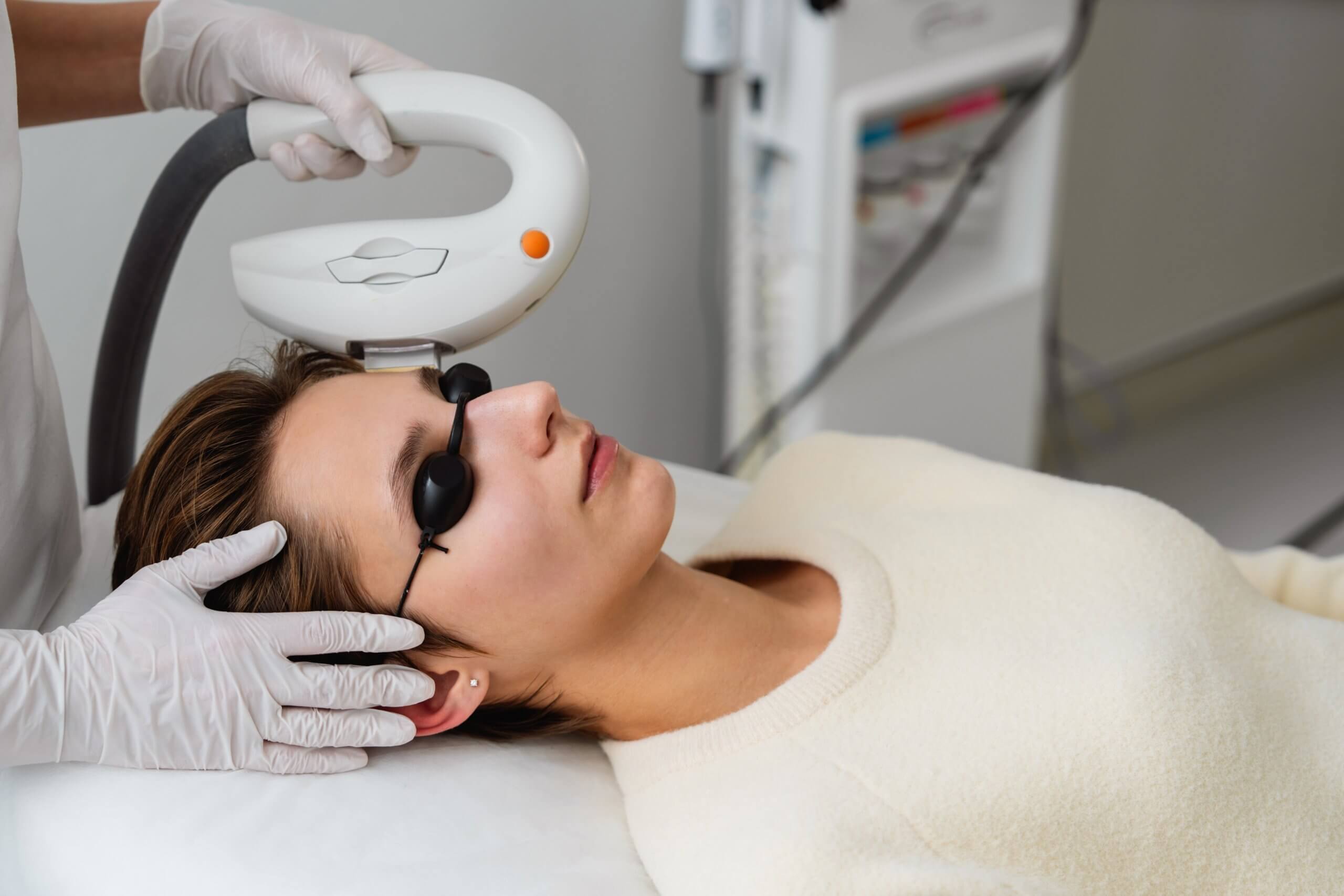 cosmetic laser technician vs. cosmetic injector, cosmetic laser technicians perform aesthetic laser treatments like the Photofacial being performed on the woman in the image