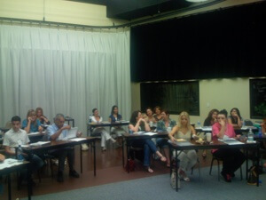 National Laser Institute students gather in a classroom setting and begin to be educated about laser hair removal.